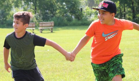 Two boys playing a field game