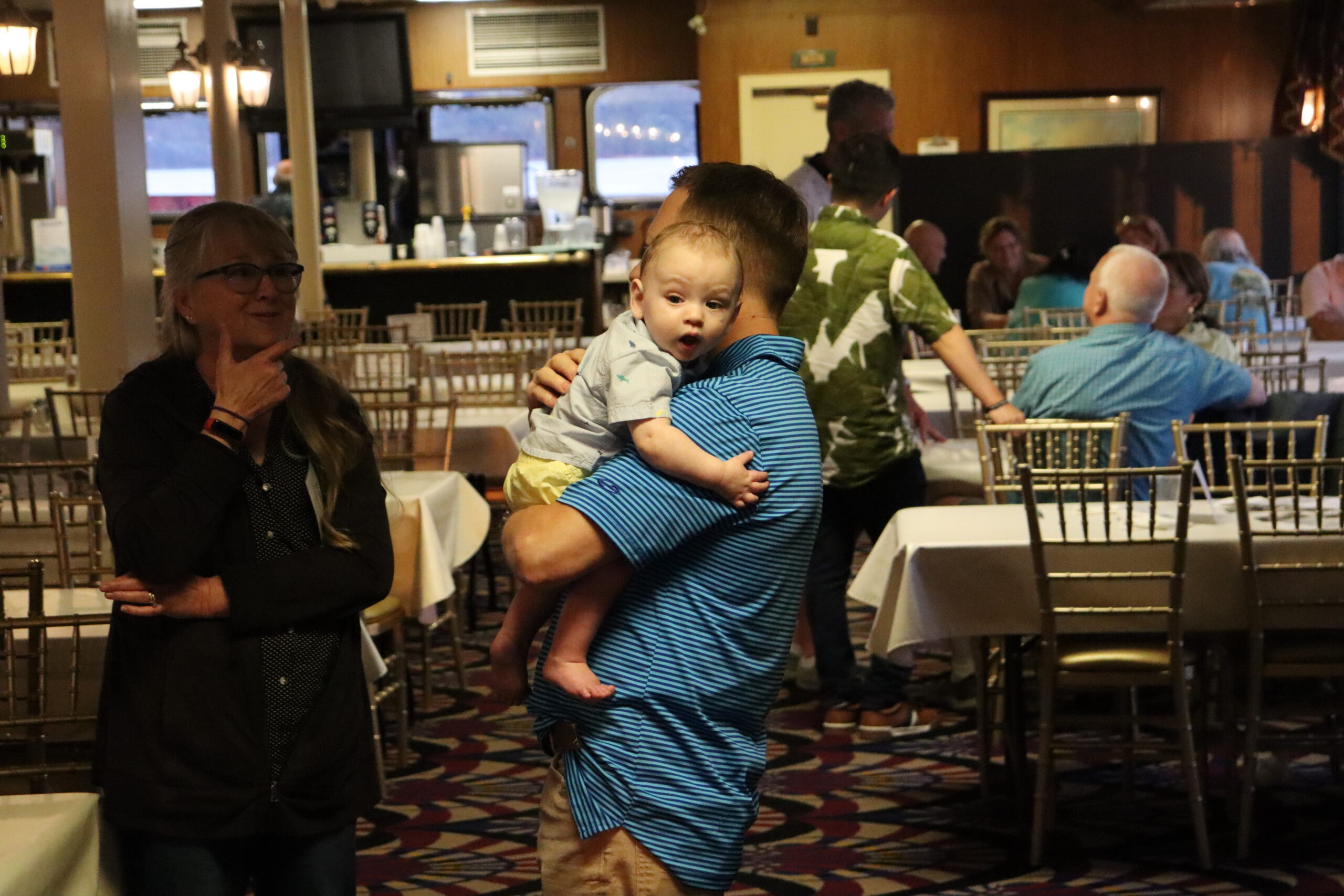 Chris holding grandson