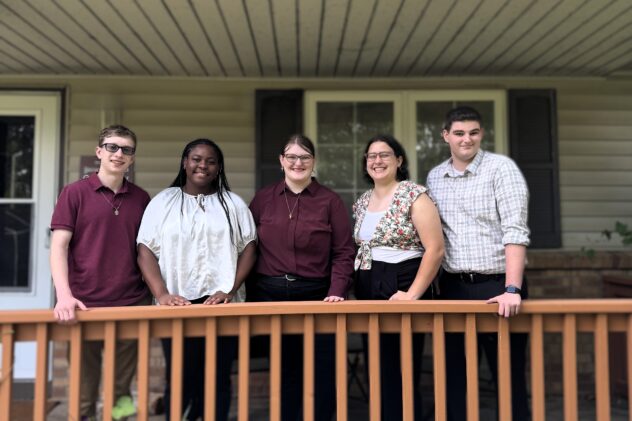 Five young adults on front porch.