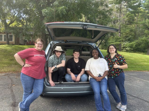 Five young adults in the DSL team van.