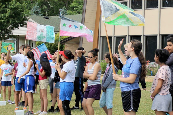 Youth with handmade flags