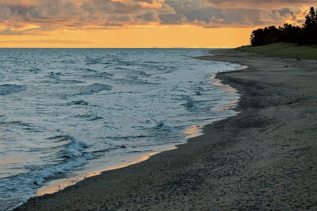 Lake Superior Shoreline with a peach-colored sunset